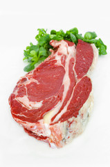 Pieces of crude meat, beef steak on white. Isolated