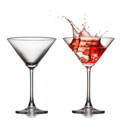 empty anв full martini glass with red cocktail with splash isol