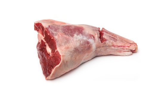 Leg of lamb isolated on a white studio background.