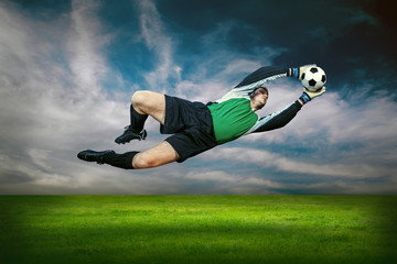 Football goalkeeper in action outdoors