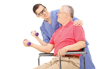 Fototapeta na wymiar Physiotherapist showing an exercise to a mature man