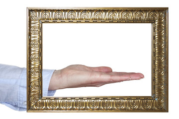 Outstretched hand behind picture frames