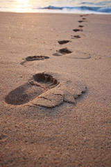 Footprints on the beach sand.Traces on the beach. Footsteps on t