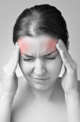 Young woman having migraine