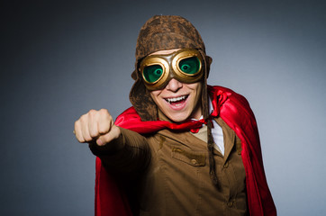 Funny pilot with goggles and helmet