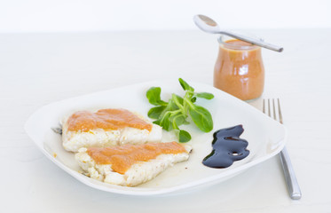 Tomato sauce. Grilled fish with tomato sauce and vegetables