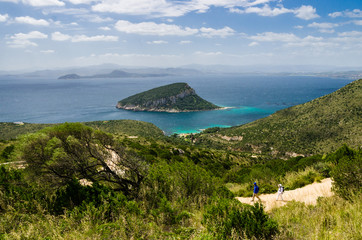 Sardinia: Capo Figari and Figarolo island. People hiking.
