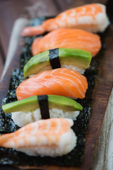 Close-up of a sushi set with salmon, shrimp and avocado