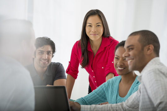 A Multi Ethnic Group Of People Around A Table, Men And Women. Teamwork. Meeting.
