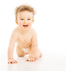 Baby happy smiling with tousled hairs, active boy in diaper