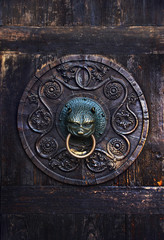 Antique knob on a wooden door, Augsburg, Germany