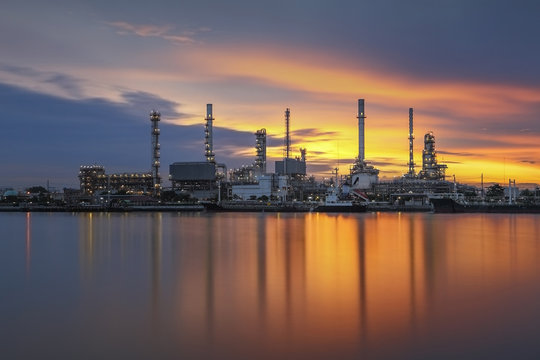 Oil refinery with sunrise background