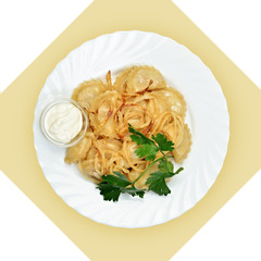 Dish with dumplings on white plate. Isolated image.