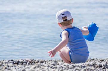 Little boy playing on the beach