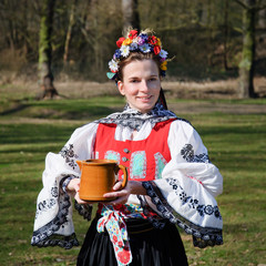 The smiling girl in folk costume