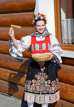 The smiling girl in folk costume