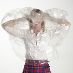 Woman putting on a plastic poncho