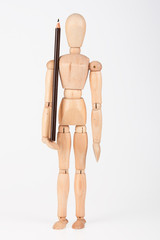 Small wood mannequin standing with colour pencil isolated on whi