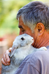 Man with gray rabbit