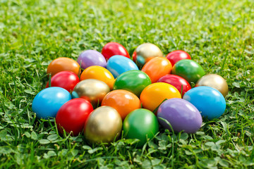 Fototapeta na wymiar Colorful easter eggs in grass