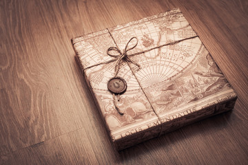 beautifully packaged parcel in brown paper and tied with a rope