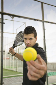 Paddle tnnis player ready for serve