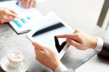 touchpad in businessman hands during meeting