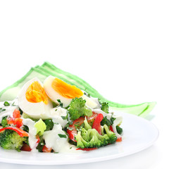 Salad with broccoli,  egg and sauce with yogurt and garlic