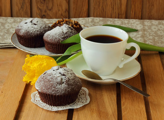 Morning coffee, chocolate cake and yellow tulip
