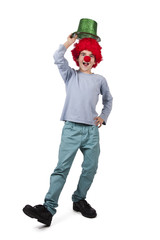 boy with clown nose and hat isolated on white background