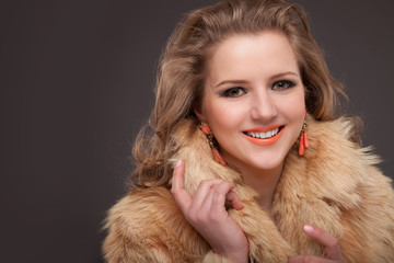 Beauty Fashion Model Girl in fox Fur Coat. Beautiful Luxury 