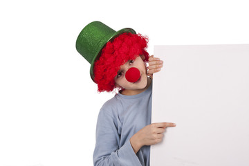 boy with clown nose and hat isolated on white background