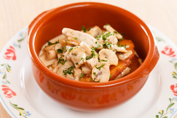 potato pancakes with meat in the pot