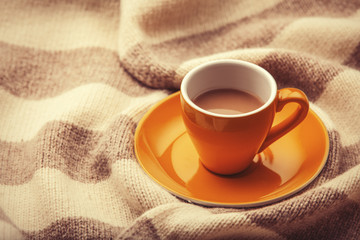 yellow cup of the coffee and vintage scarf.