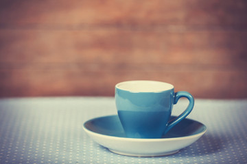 Cup of a coffe on polka dot cover