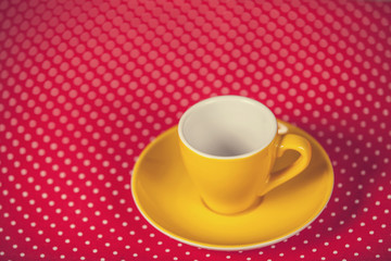 Cup of a coffe on polka dot cover
