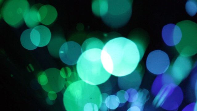 Abstract Motion Background. Blurred multicolored lights with bok