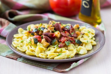 Italian pasta orecchiette with stew of vegetables and beans