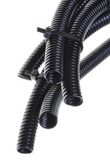 Black corrugated pipe isolated on white background 