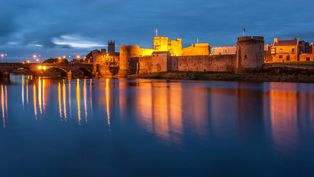 King John's castle reflected on the River Shannon at dusk, Limerick, Ireland