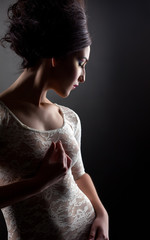 Naklejka premium Profile of young sexy model in lacy negligee