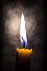 Candle on blur background. - 62715540