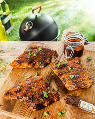 Preparing ribs for a BBQ with savory basting sauce