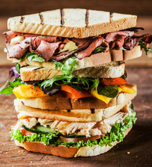 Stacked grilled sandwiches with fresh ingredients © exclusive-design