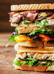 Stack of three delicious toasted sandwiches