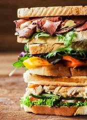 Wall murals Snack Stack of three delicious toasted sandwiches