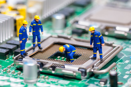 Group of construction workers repairing CPU