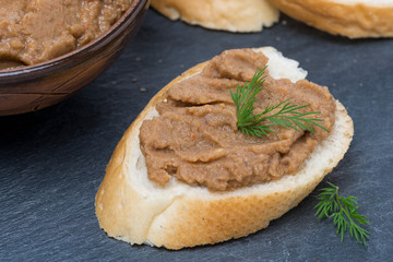 pate of chicken liver and roasted peppers on a piece of bread