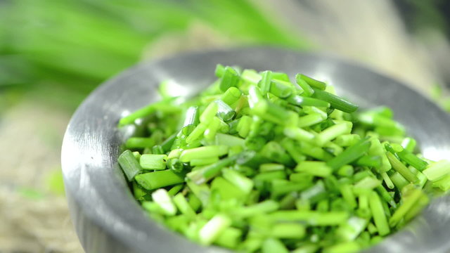 Portion of fresh cutted Chive (loopable HD video)