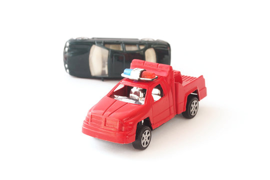 toy cars in accident on white background